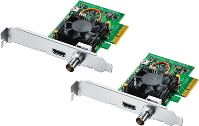 Two video capture cards with HDMI and BNC connectors, each featuring a small fan and heatsink on a green circuit board.