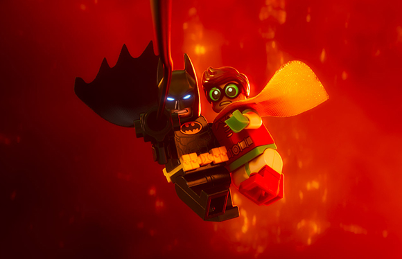 Lego Batman and Robin minifigures flying together against a glowing red background.