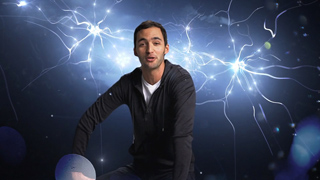 A man in a black shirt looking forward against a dark blue background of glowing, interconnected light filaments.