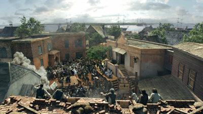 A high-angle view of a crowded town square with historic brick and wooden buildings under a cloudy sky.