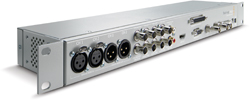 Silver rack-mountable audio interface featuring XLR, BNC, and other professional audio connectors.
