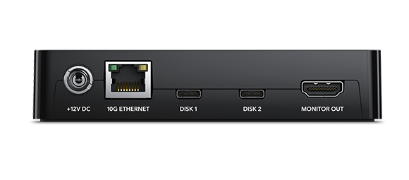 Rear view of a black electronic device with power, ethernet, disk, and monitor ports.