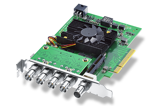 Green circuit board with a black heatsink fan and five silver BNC connectors on a metal bracket.