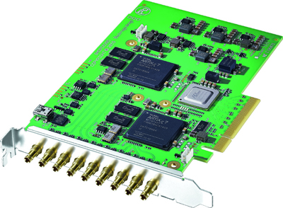 Green printed circuit board with microchips, capacitors, and a row of gold-colored coaxial connectors.