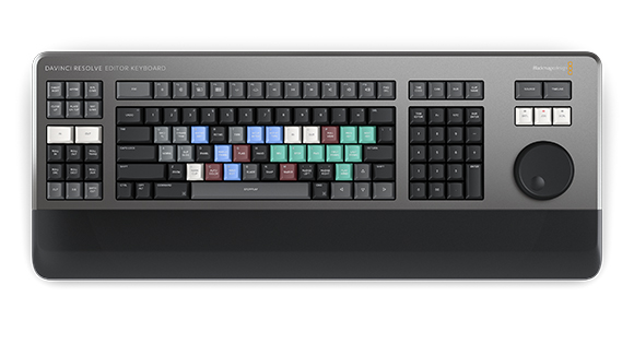 A professional DaVinci Resolve Editor Keyboard with various colored keys and a large control dial.