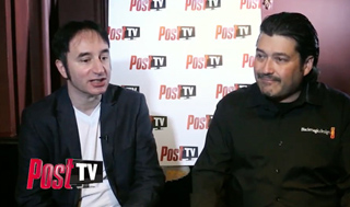 Two men sit side-by-side in front of a white backdrop with red and black Post TV logos.