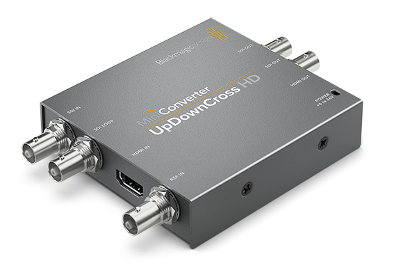 A grey rectangular Blackmagic Design Mini Converter with various SDI and HDMI ports on its sides.