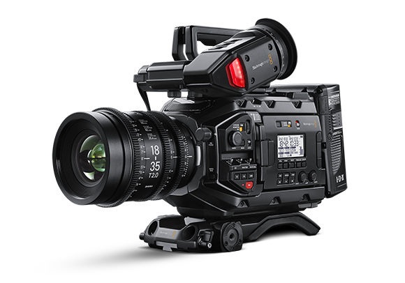 A professional black digital cinema camera with a large lens and various control buttons on a white background.