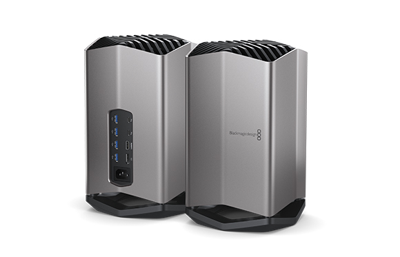 Two silver metallic desktop computer towers with black vents and ports on a white background.
