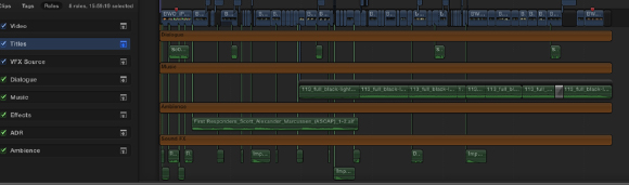 A digital interface of a video editing timeline with various colored tracks for dialogue, music, and effects.