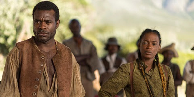 A man and woman in historical attire looking off-camera with serious expressions.
