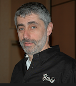 A middle-aged man with short gray hair and a salt-and-pepper beard looking toward the camera.