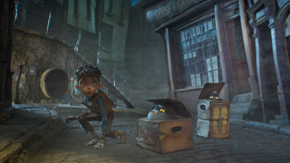 A young boy crouches in a dark alley next to two cardboard boxes containing small creatures.