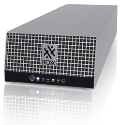 A silver rectangular electronic device with a white grid front and a black bottom panel featuring a power button.
