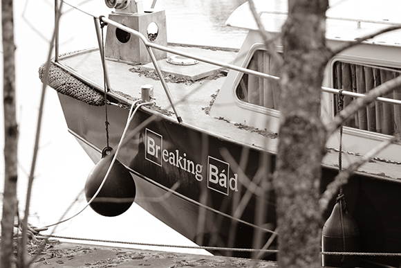 A black and white close-up of a boat hull with the words 'Breaking Bad' printed on it.