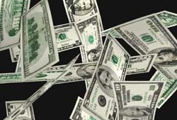 Multiple US dollar bills falling and floating against a solid black background.