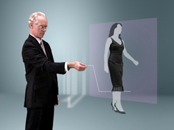 A man in a dark suit reaches out toward a translucent, glowing projection of a woman in a black dress.