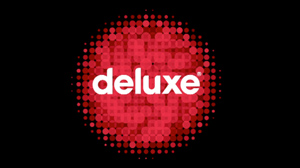 The word deluxe in white lowercase letters centered over a red halftone sphere on a black background.