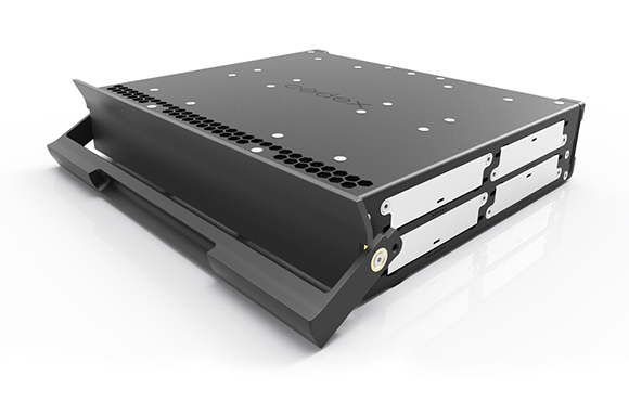A black, rectangular electronic device with a handle and ventilation slots on a white background.