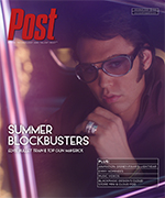 Austin Butler as Elvis Presley wearing sunglasses and a ring, looking forward.