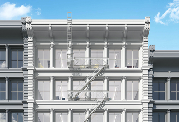White classical building facade with columns, large windows, and a metal staircase climbing the exterior.