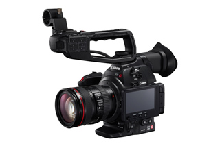 A black Canon professional digital video camera with a large lens and top handle against a white background.
