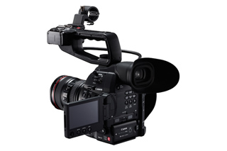 A professional black Canon digital video camera with a large lens and an adjustable LCD screen.