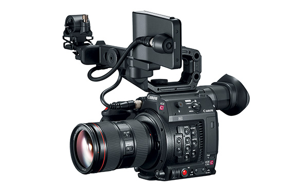 A black Canon digital cinema camera equipped with a large lens and an attached top monitor.