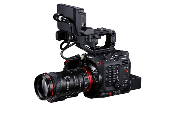 A black Canon cinema camera equipped with a 70-200mm lens and an attached top monitor.