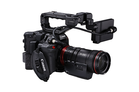 A black Canon professional cinema camera equipped with a 70-200mm lens and an attached external monitor.