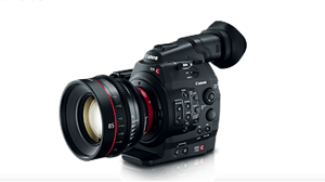A black Canon professional cinema camera with a large lens and various control buttons.