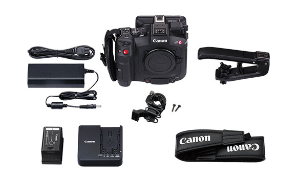 Canon EOS C digital cinema camera, battery charger, extra batteries, cables, and a top handle on a white background.