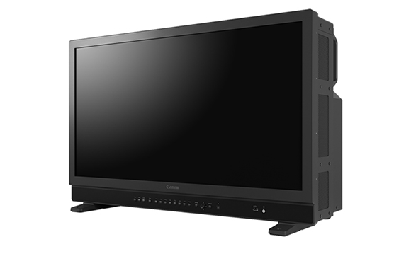 A large black Canon professional monitor with a wide screen and control buttons on the bottom bezel.