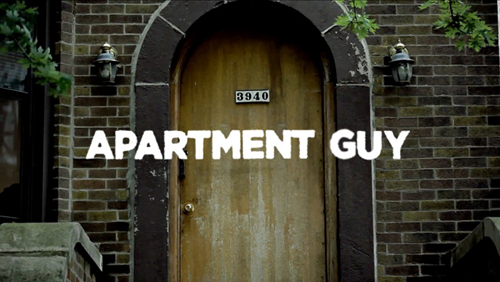 White text reading 'APARTMENT GUY' over an arched wooden door set in a brick wall.