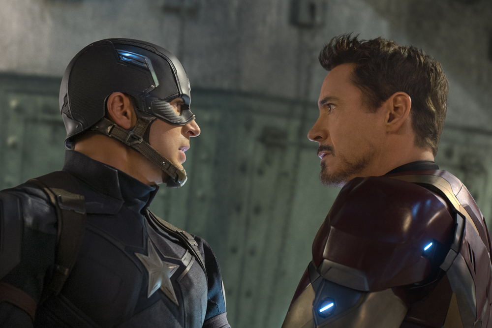 Captain America and Iron Man stand face-to-face in a tense confrontation.
