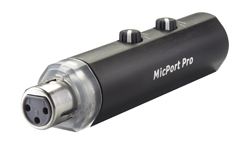 A black cylindrical MicPort Pro audio interface with two control knobs and an XLR input port.