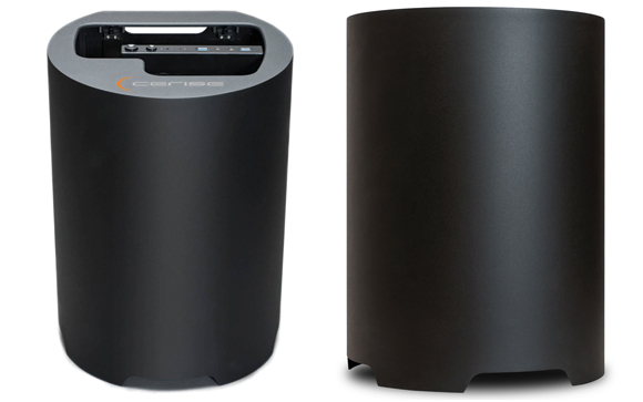 Two views of a matte black cylindrical electronic device, one showing the top opening and one showing the side.