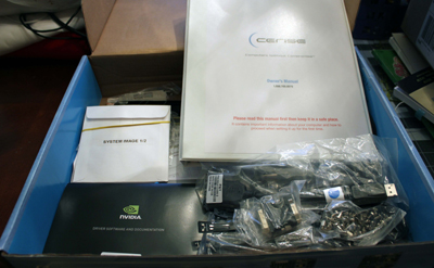 An open blue box containing a Cerise manual, NVIDIA documentation, and various packaged cables and hardware.