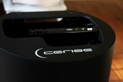 A close-up of a black electronic device with the word CERISE in white lettering.