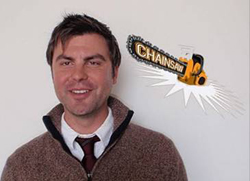 A smiling man in a brown sweater and tie next to a stylized chainsaw logo.