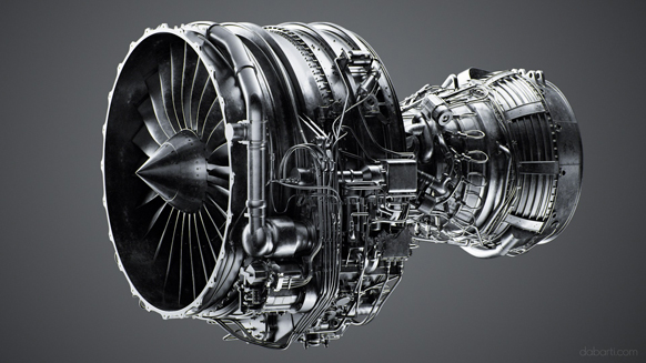 A complex, metallic jet engine with visible turbine blades and intricate wiring against a gray background.