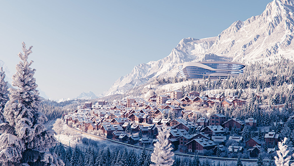 A snowy mountain village with wooden chalets sits below a large, curved modern building under a clear sky.