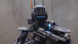 A dark, armored robot with a glowing blue visor and antennas holding a large firearm.