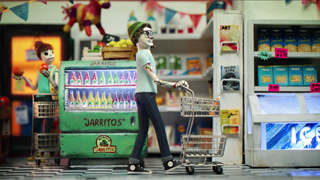Stop-motion characters walk through a grocery store aisle with shopping carts near a green soda cooler.