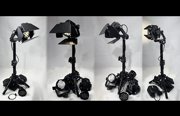 Four views of a black adjustable studio light on a tripod stand against a white background.