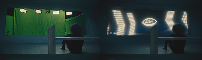 Silhouette of a person sitting in a dark room, facing a large glowing screen with a loading icon.