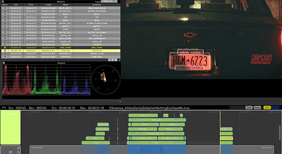 Video editing software interface displaying a timeline and a video frame of a car's license plate.