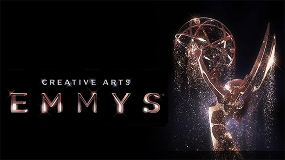 Text reading Creative Arts Emmys next to a shimmering gold Emmy award statue against a black background.