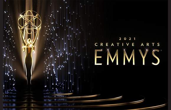 Gold Emmy statuette against a dark background with shimmering light streaks and text.
