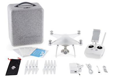 DJI Phantom drone, remote controller, carrying case, spare propellers, and charging accessories on a white background.